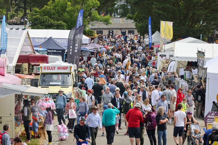 Visitors walking between stalls at the Royal Cornwall Show.